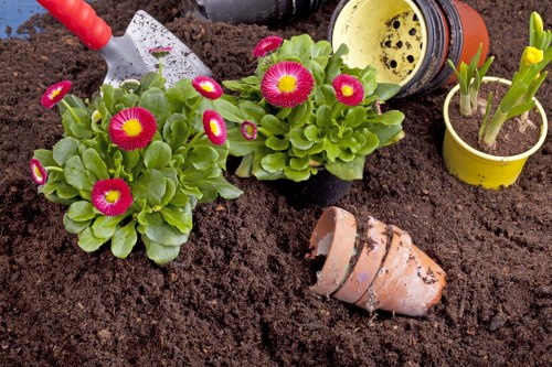 Gardener preparing tools at the start of a garden maintenance job